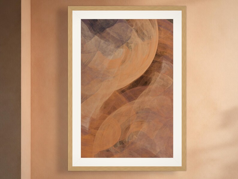 May include: A rectangular wall art print in a light wood frame with a white mat. The artwork features an abstract composition of swirling, translucent layers in shades of burnt orange, deep brown, and muted gray, creating a fluid, layered effect.