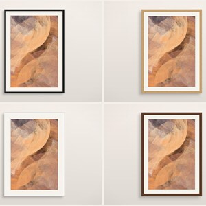 May include: Four rectangular wall art prints featuring an abstract desert canyon landscape with swirling orange, tan, and dark purple rock formations. Each print is displayed in a different frame color: black, light wood, white, and dark brown.