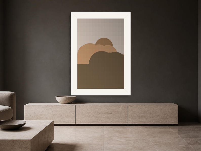 Puede incluir: Una l&aacute;mina de arte mural enmarcada que presenta una serie de formas abstractas redondeadas y superpuestas en varios tonos de marr&oacute;n, beige y arena, sobre un fondo gris claro, dentro de un marco rectangular blanco grueso.