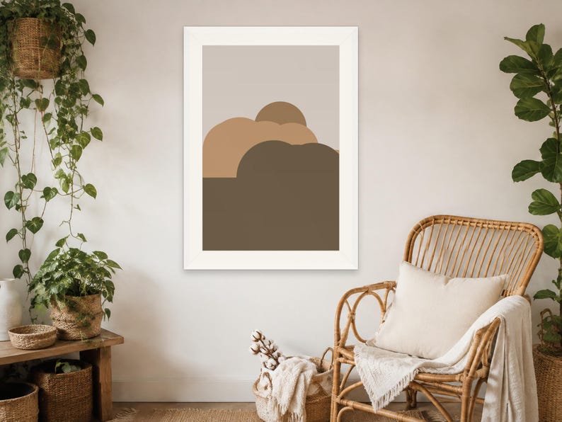 Puede incluir: Una impresi&oacute;n de arte mural rectangular que presenta una serie de formas abstractas redondeadas y superpuestas en tonos beige, tostado y marr&oacute;n oscuro, sobre un fondo gris claro y dentro de un marco blanco simple.