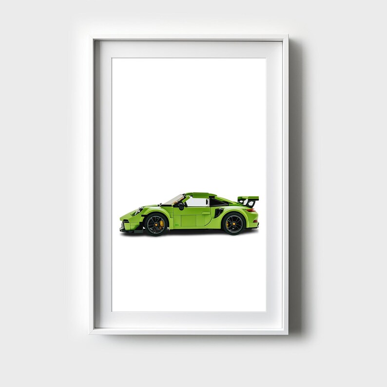 May include: A green model car with black accents and a white interior. The car is in a white frame.