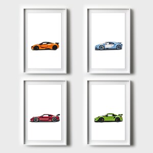 May include: Four framed prints of different sports cars. The top left print shows an orange car, the top right print shows a blue car, the bottom left print shows a red car, and the bottom right print shows a green car.