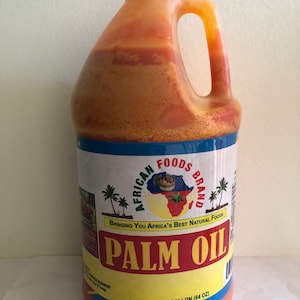 May include: A half-gallon jug of African Foods Brand Palm Oil. The jug is orange and has a blue label with the brand name and logo. The label also says "Bringing You Africa's Best Natural Foods".