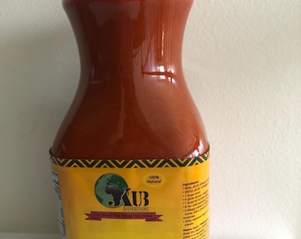 May include: A 64-ounce bottle of red palm oil labeled "Torborgee Oil" by KUB Distributors. The label reads "100% Natural" and "Prime Quality Oil from a selection of organically grown palm nuts".