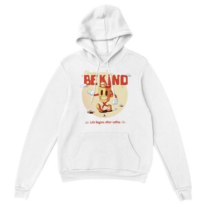 May include: White hoodie with a cartoon coffee cup character wearing a red hat and walking. The text "Please Be Kind" is above the character and "Life begins after coffee" is below the character.