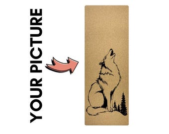 May include: A brown cork yoga mat with a black silhouette of a wolf howling at the moon. The wolf is surrounded by a small forest of trees.