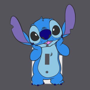 May include: A light blue cartoon character, Stitch, is depicted on a white light switch cover. Stitch has large black eyes, a dark blue nose, and purple ears. The light switch cover is set against a grey background.