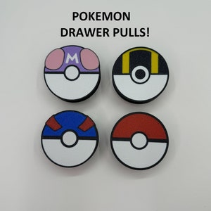 May include: Four round drawer pulls with a black border, each featuring a different Pokemon design. The top two pulls have purple and yellow accents, while the bottom two are blue and red. The text "Pokemon Drawer Pulls!" is above the pulls.