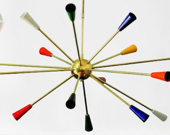 May include: A multi-armed sputnik chandelier featuring a central brass sphere with radiating thin brass rods. Each rod terminates in a conical shade painted in various colours including red, blue, yellow, green, white, and black.