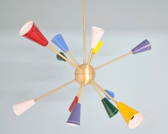 May include: A gold metal chandelier with 10 colourful cone-shaped shades. The shades are red, blue, yellow, green, and purple.