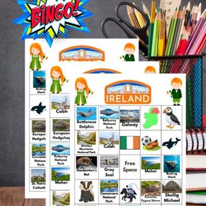 May include: A colorful Ireland-themed bingo game with illustrations of animals, landmarks, and the Irish flag. The word "BINGO!" is displayed in a comic book style speech bubble. Pencils, a ruler, and scissors are in the background.