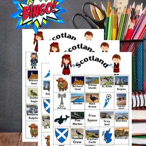 May include: A stack of Scotland-themed bingo cards with illustrations of Scottish landmarks and symbols. The word "BINGO!" is in a comic book style speech bubble. Pencils, scissors, and a ruler are in the background.