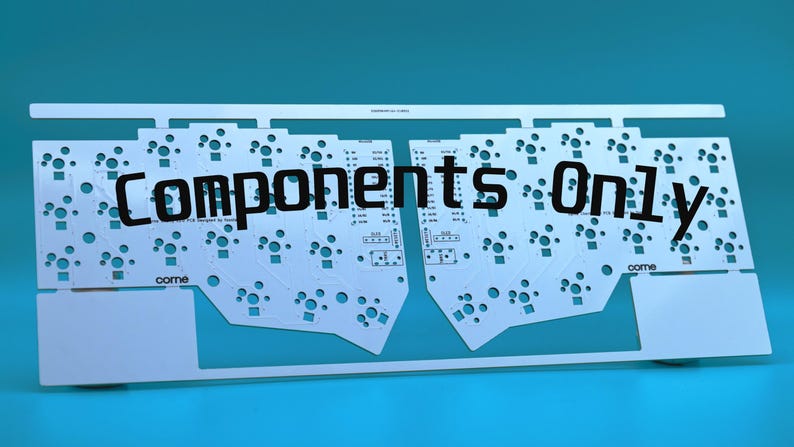 May include: A white printed circuit board panel featuring two symmetrical keyboard layouts with numerous circular switch cutouts and the text "come" printed on each side. The words "Components Only" are overlaid in black across the center.