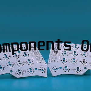 May include: Two white printed circuit boards for a split mechanical keyboard, featuring numerous circular switch sockets and gold-colored contact points. The boards are angled and display the text Components Only overlaid in black.