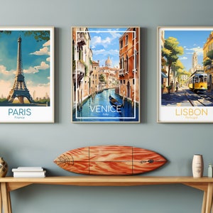 May include: Three vintage travel posters with images of Paris, Venice, and Lisbon. The Paris poster features the Eiffel Tower, the Venice poster shows a canal with a gondola, and the Lisbon poster depicts a street scene with a yellow tram.