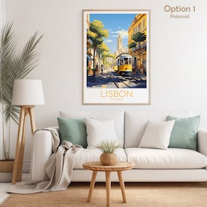 May include: A framed art print of Lisbon, Portugal, featuring a yellow tram on tracks in a sunlit street scene. The print has a light wooden frame and is displayed above a white sofa with green and white pillows. The text "LISBON Portugal" is at the bottom.