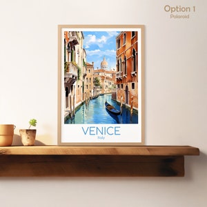 May include: A framed print of a watercolor painting depicting a canal in Venice, Italy. The canal is lined with colorful buildings and a gondola is floating in the water. The text "VENICE Italy" is printed at the bottom of the print.