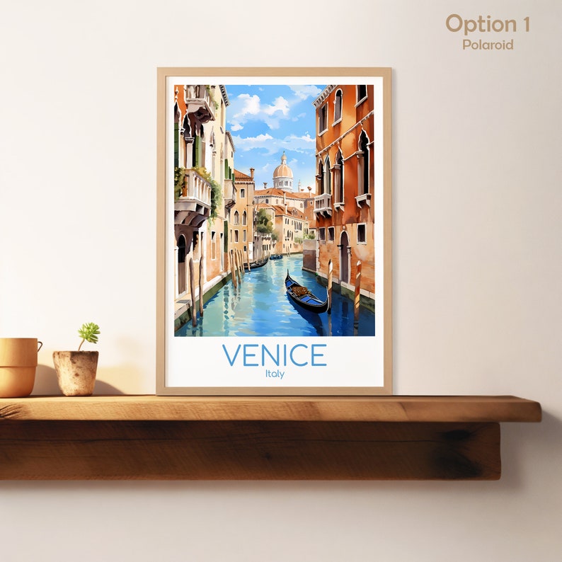 May include: A framed print of a watercolor painting depicting a canal in Venice, Italy. The canal is lined with colorful buildings and a gondola is floating in the water. The text "VENICE Italy" is printed at the bottom of the print.