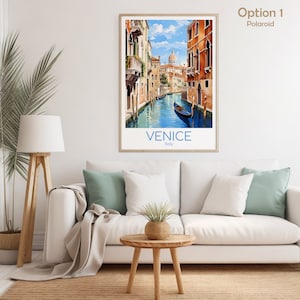 May include: A vintage travel poster featuring a watercolor illustration of a canal in Venice, Italy. The poster has a blue and white color scheme and features a gondola in the canal. The text "VENICE" and "Italy" is printed in blue at the bottom of the poster.