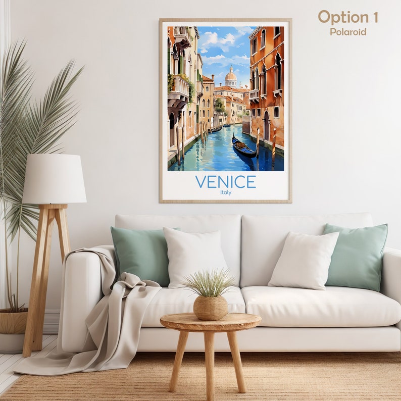 May include: A vintage travel poster featuring a watercolor illustration of a canal in Venice, Italy. The poster has a blue and white color scheme and features a gondola in the canal. The text "VENICE" and "Italy" is printed in blue at the bottom of the poster.