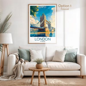 May include: A framed art print featuring a watercolor illustration of the Tower Bridge in London, England. The print has a blue, yellow, and brown color scheme. The word "LONDON" is printed in blue at the bottom of the print.