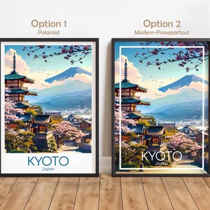 以下が含まれることがあります： 京都の鮮やかなイラストが描かれた、額装されたアートプリント。このアートワークは、日本の伝統的な建築物、桜、山を背景にしています。「京都」の文字が太字で表示されています。