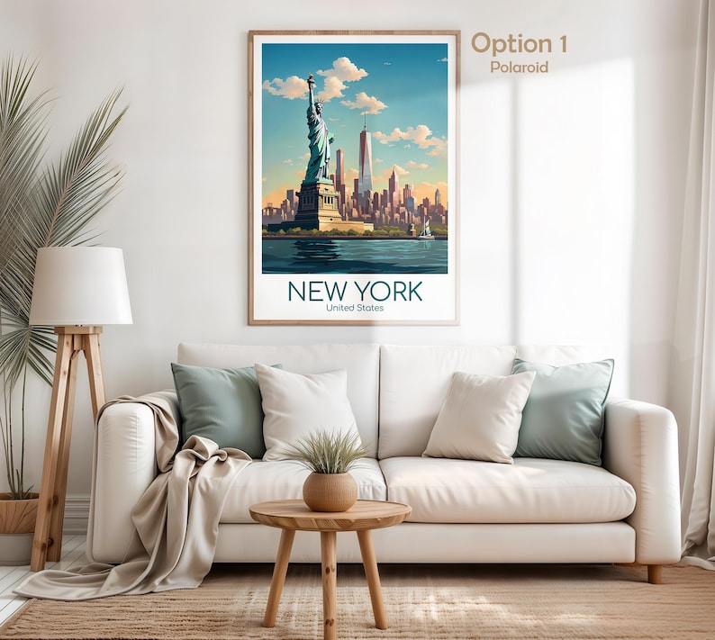 May include: A framed wall art print featuring a stylized illustration of the Statue of Liberty and the New York City skyline. The text "NEW YORK" and "United States" is printed at the bottom. The artwork displays blue, orange, and tan tones.