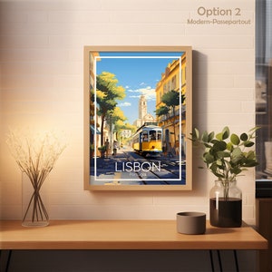 May include: Framed art print featuring a vibrant street scene in Lisbon, Portugal. A yellow tram travels down a cobblestone street lined with buildings. The print includes the text "LISBON" and "Portugal".
