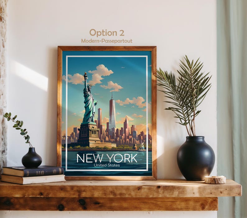 May include: A framed art print featuring a stylized illustration of the Statue of Liberty and the New York City skyline under a blue sky with clouds. The text NEW YORK United States is printed at the bottom. The frame is brown wood.