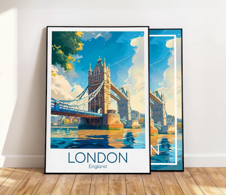 May include: Two framed art prints featuring a stylized illustration of the Tower Bridge in London. The artwork depicts the bridge over water under a blue sky with clouds. The word "LONDON" and "England" are printed at the bottom of the primary print.