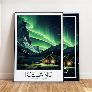 May include: Two framed art prints featuring a landscape of Iceland's Northern Lights. The artwork depicts a green aurora borealis over mountains and illuminated cabins. The word "ICELAND" and "Northern Lights" are printed at the bottom of the print.
