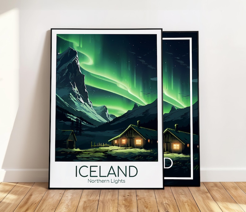May include: Two framed art prints featuring a landscape of Iceland's Northern Lights. The artwork depicts a green aurora borealis over mountains and illuminated cabins. The word "ICELAND" and "Northern Lights" are printed at the bottom of the print.