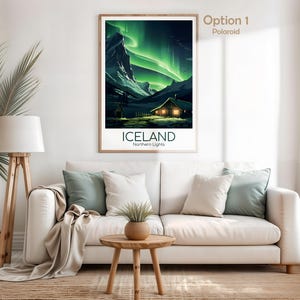May include: A framed poster featuring a landscape of Iceland's Northern Lights. The artwork depicts a cabin with lit windows under a vibrant green aurora borealis. The word "ICELAND" is printed below the image.