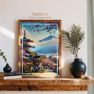 以下が含まれることがあります： 京都の風景を描いた額入りのアートプリント。五重塔、桜、富士山が描かれています。木製のフレームに白い縁取り。下部に「KYOTO Japan」の文字。上部には「Option 2 Modern-Passepartout」の文字。
