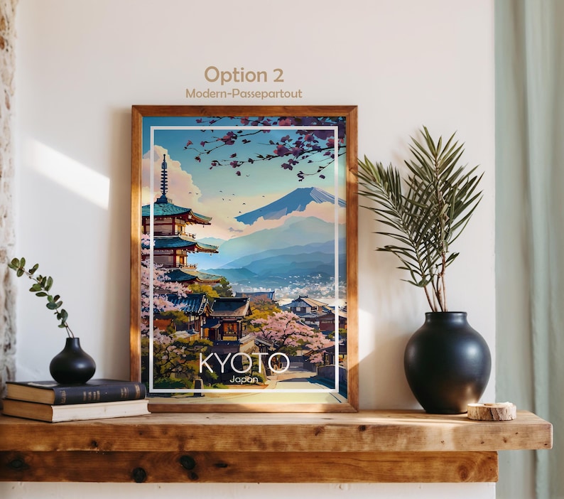 以下が含まれることがあります： 京都の風景を描いた額入りのアートプリント。五重塔、桜、富士山が描かれています。木製のフレームに白い縁取り。下部に「KYOTO Japan」の文字。上部には「Option 2 Modern-Passepartout」の文字。