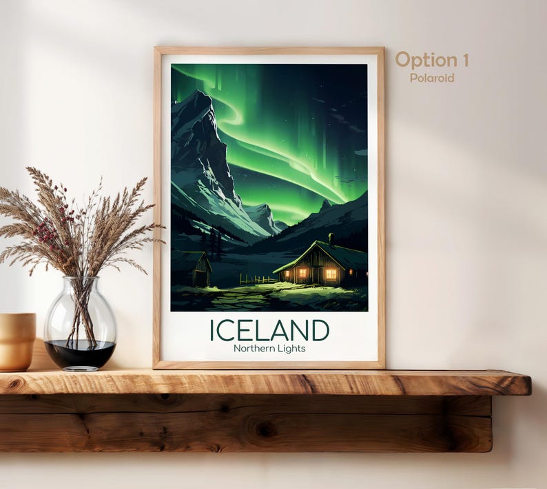 May include: Framed art print of Iceland's Northern Lights. The artwork depicts a cabin with lit windows under a vibrant green aurora borealis. The word "ICELAND" is printed in bold, with "Northern Lights" below.