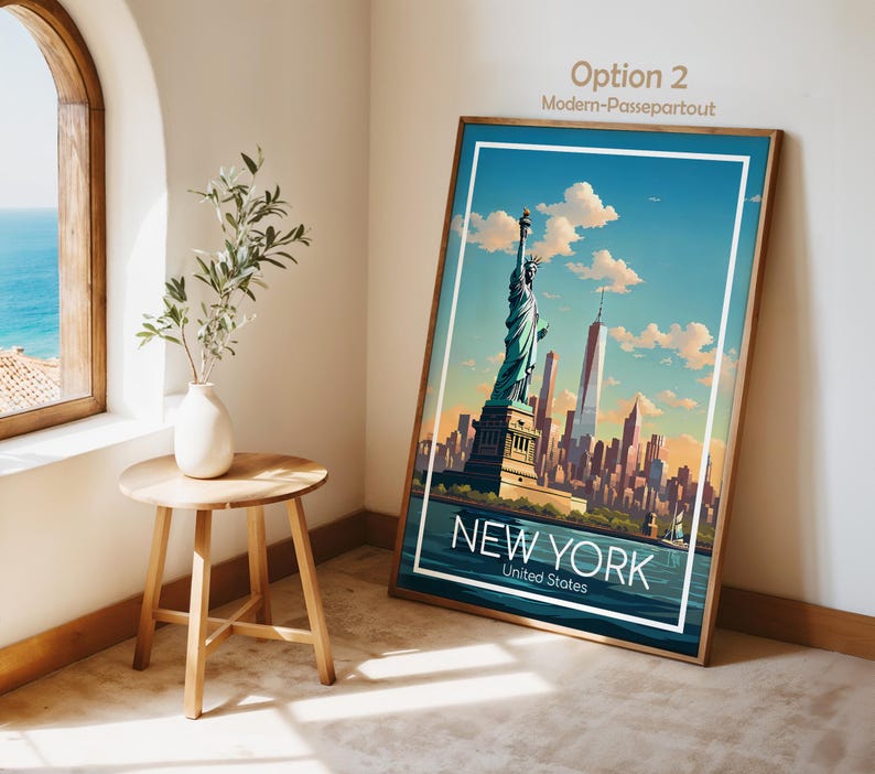 May include: A framed vertical art print featuring a stylized illustration of the Statue of Liberty and the New York City skyline under a blue sky with clouds. The text NEW YORK United States is printed in white at the bottom of the artwork.
