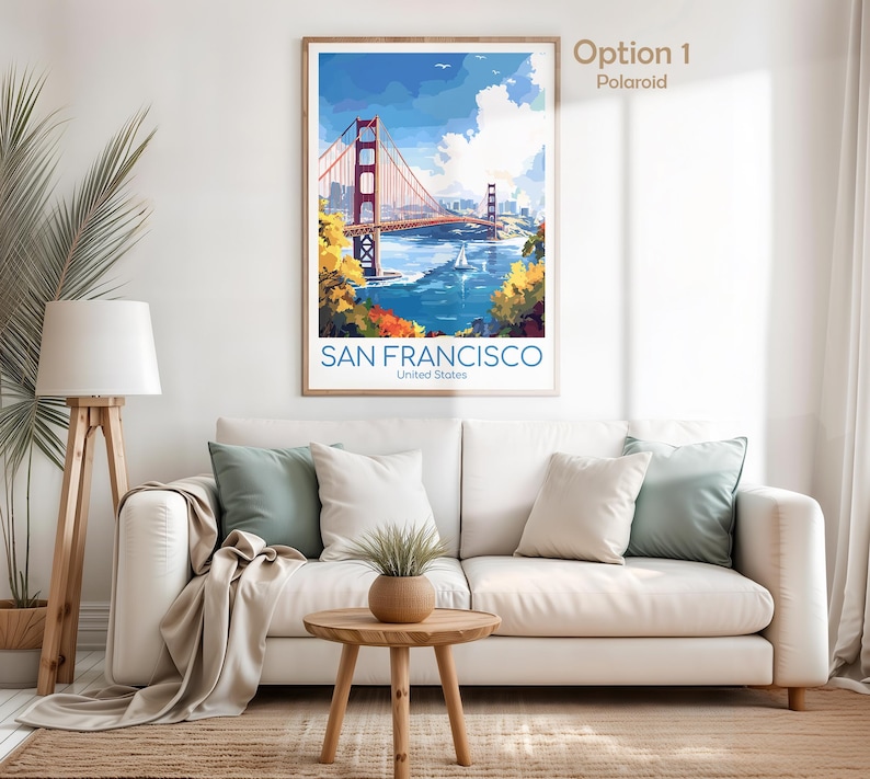 May include: A framed art print of the Golden Gate Bridge in San Francisco. The artwork features the bridge in red, with blue water and sky. The text "SAN FRANCISCO United States" is at the bottom.