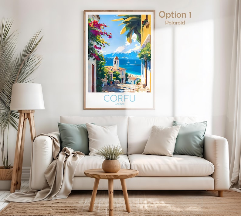 Op de afbeelding: Een ingelijste verticale wandkunstprint getiteld CORFU Greece met een kleurrijke mediterrane kustsc&egrave;ne met levendige roze bougainvillea, een stenen pad, witte gebouwen, een blauwe zee en een heldere lucht.