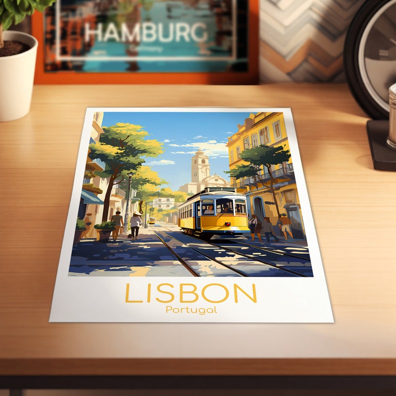 May include: A print featuring a vibrant street scene in Lisbon, Portugal, with a yellow tram on tracks. The image includes the word "LISBON" in gold lettering, with "Portugal" below. The artwork is set against a blue sky and sunny day.