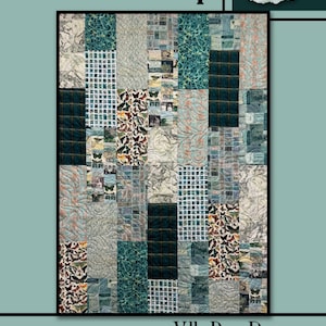 May include: A patchwork quilt with a variety of patterned squares in shades of teal, blue, and cream. The quilt features butterfly and floral motifs, with the word "Snowdrop" at the top and "Villa Rosa Designs" at the bottom.