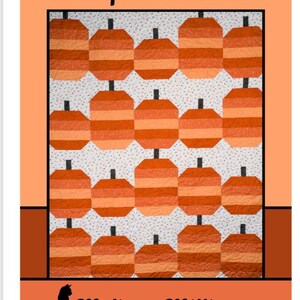 May include: A quilt with a repeating pattern of orange and light orange pumpkins with black stems on a white dotted background. The quilt is framed by an orange border with the text "Pumpkin Parade" and the designer's name.