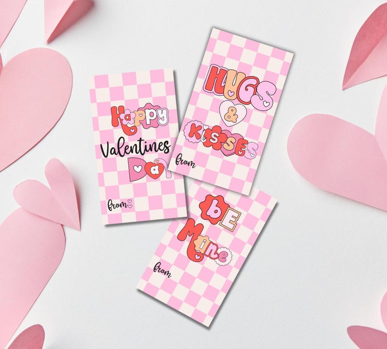 May include: Three pink and white checkered Valentine's Day cards with different messages. The first card says "Happy Valentines Day" with a pink heart and bow. The second card says "Hugs & Kisses" with a pink heart. The third card says "Be Mine" with a pink heart.
