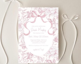 May include: A pink and white invitation with a floral and bow design. The text reads "Join us to celebrate Sarah Murphy the mama to be" with event details. White ribbons are draped around the invitation.