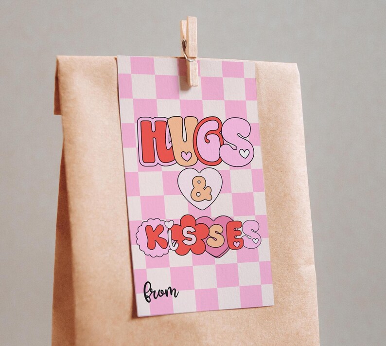 May include: A pink and white checkered gift tag with the text "Hugs & Kisses from" in a retro font. The text is in pink, red, and orange with hearts and flowers.