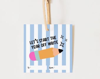 May include: A square gift tag with blue and white vertical stripes. The tag features the text "LET'S START THE YEAR OFF WRITE" above a cartoon pencil. The pencil is orange with a pink eraser and black tip. The tag has a tan ribbon.