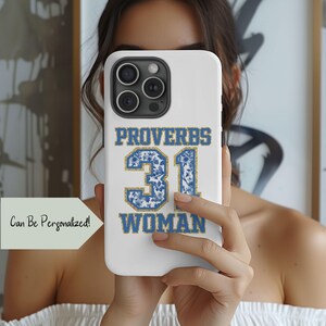 May include: White phone case with a blue and white floral design. The case has the text "Proverbs 31 Woman" in gold lettering.