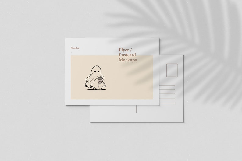 May include: Mockup of a blank white postcard with a light brown background and a ghost illustration holding a coffee cup. The text "Flyer / Postcard Mockups" is at the top of the postcard.