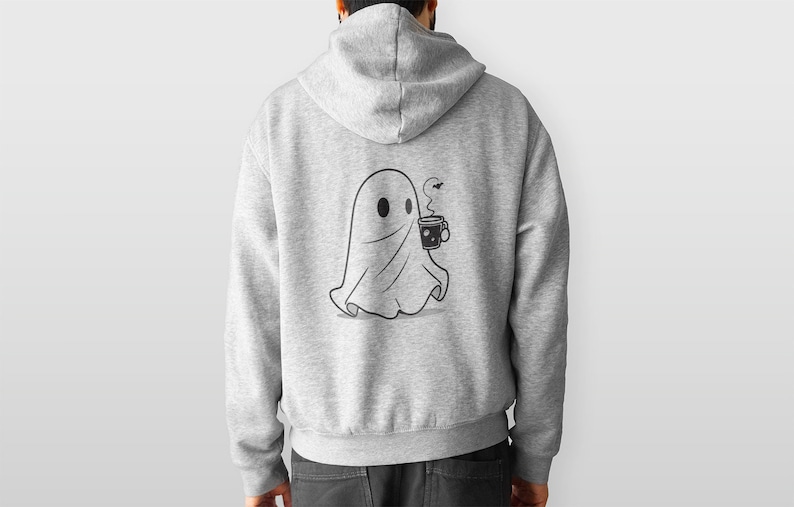 May include: A gray hoodie with a black and white illustration of a ghost holding a cup of coffee. The ghost is wearing a sheet and has a small smile on its face.