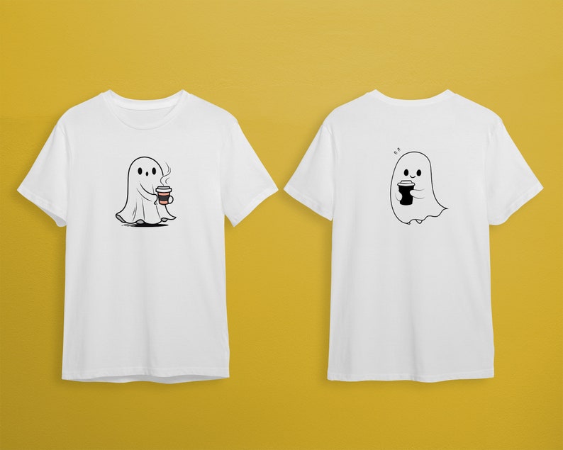 May include: Two white t-shirts with a cartoon ghost holding a cup of coffee. The ghost on the front of the shirt has a cup of coffee with steam coming from it. The ghost on the back of the shirt has a plain cup of coffee.